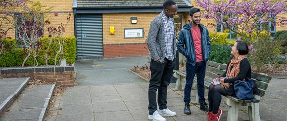 Students talking to each other near halls of residence