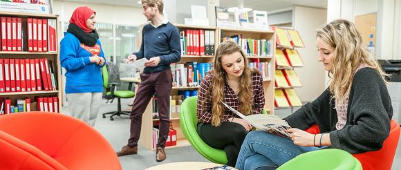 Students in careers centre receiving advice.