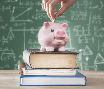 Piggy bank and books