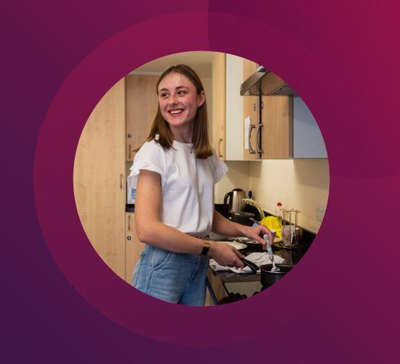 Student resident washing up at the sink