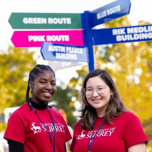 Students in front of signposts