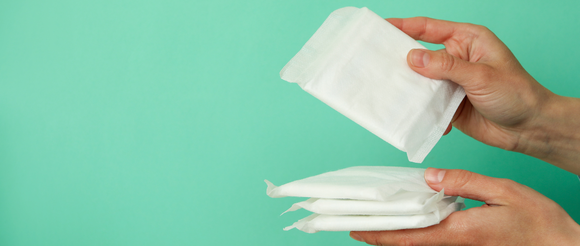 Person holding period pads