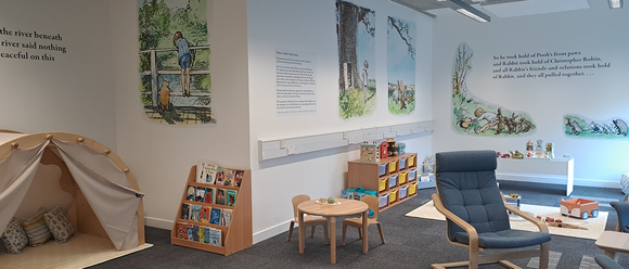 Library Family Room with books, toys, and comfy chair